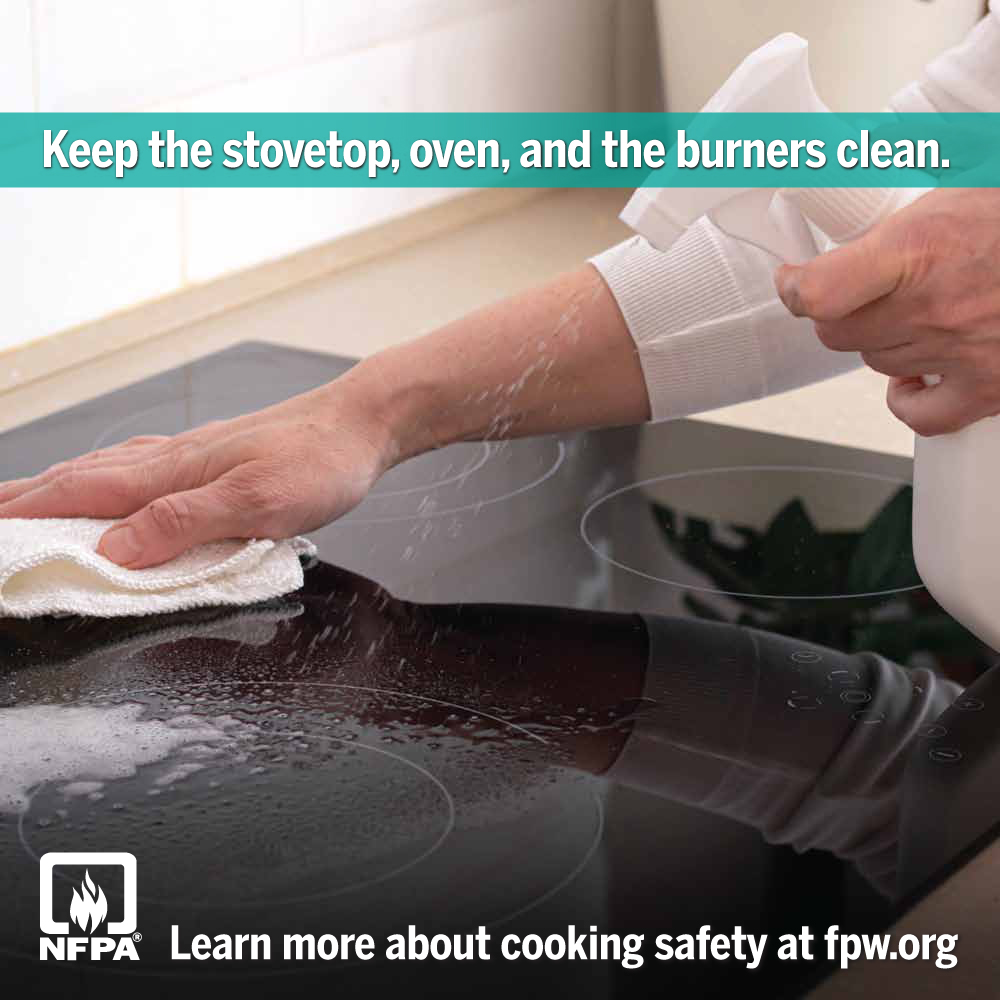 Hand cleaning the stovetop