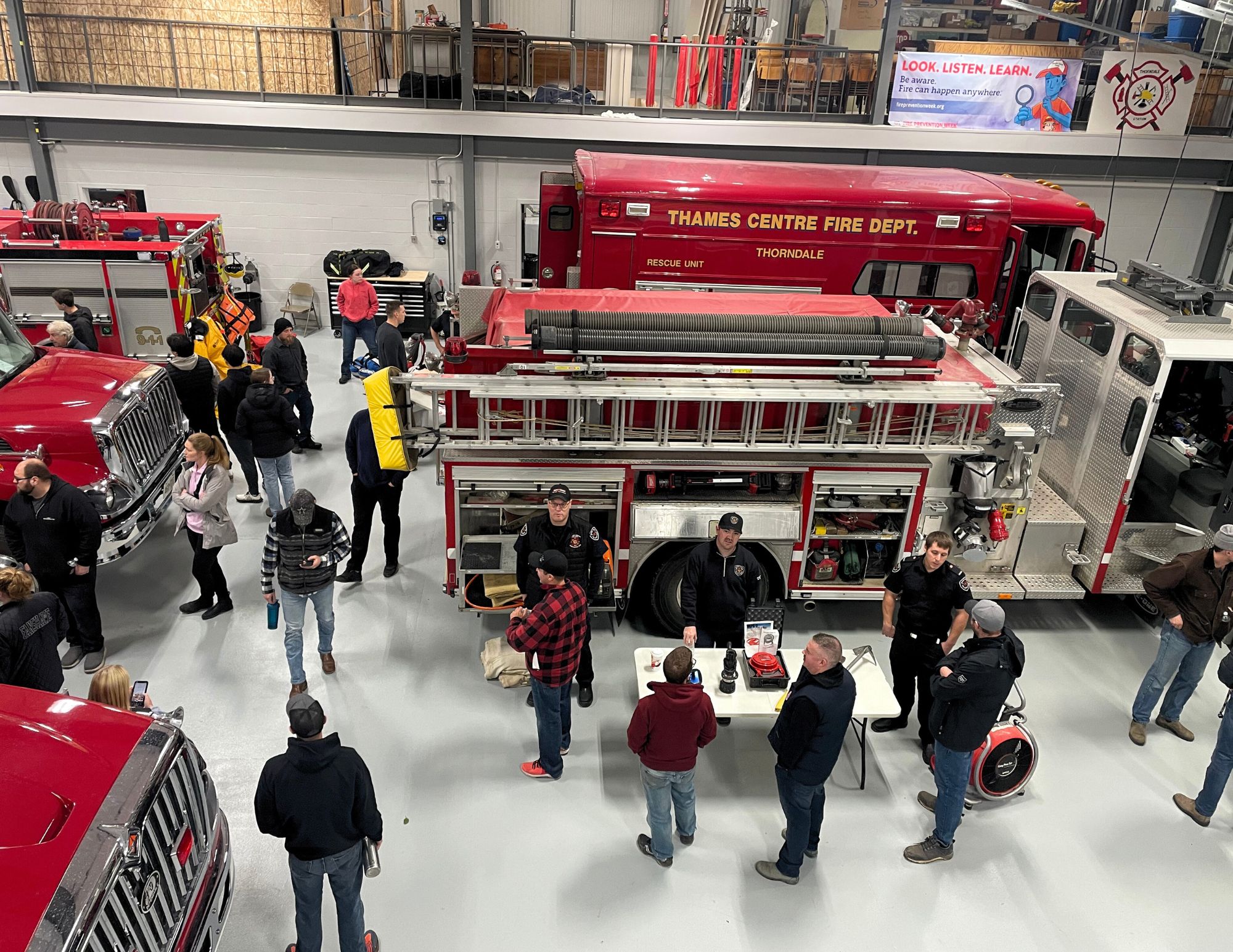 Aerial of people at the open house