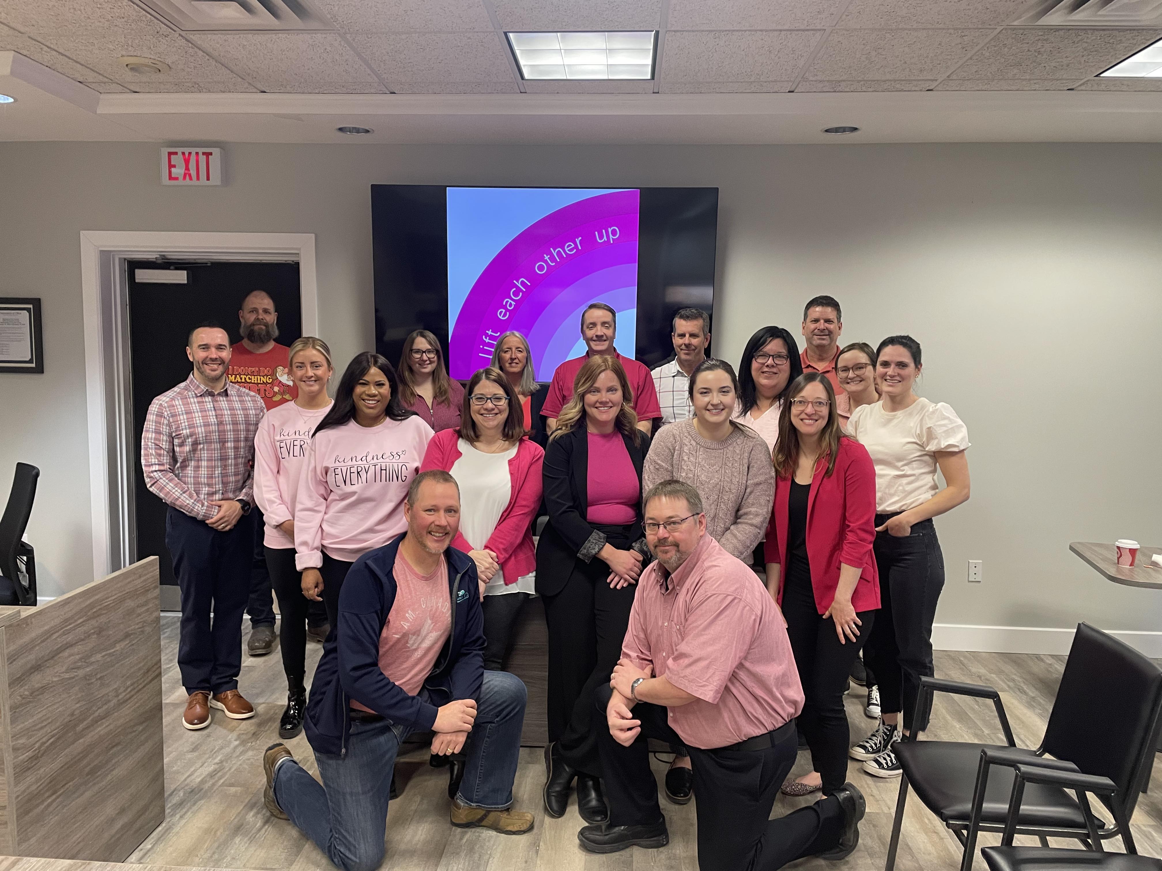 staff wearing pink shirts