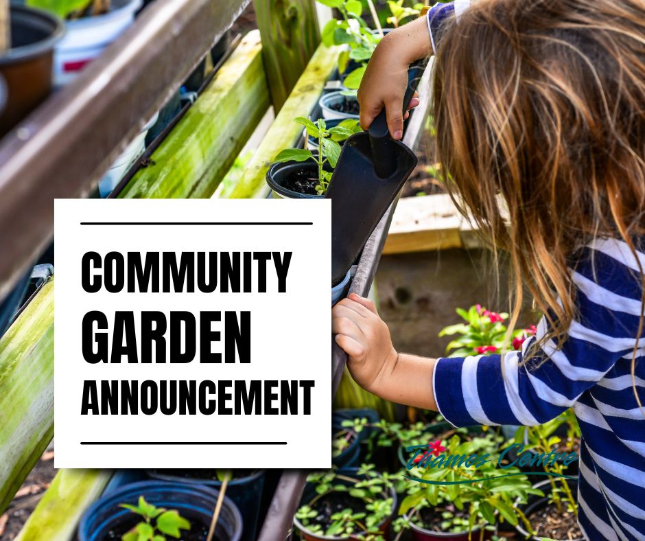 child planting in community garden