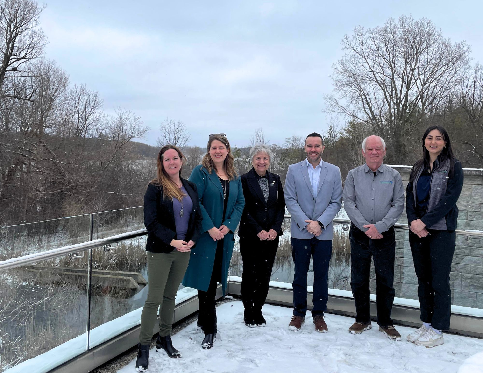 upper thames staff with mayor mcmillan and cao david barrick outside at upper thames main office overlooking the river