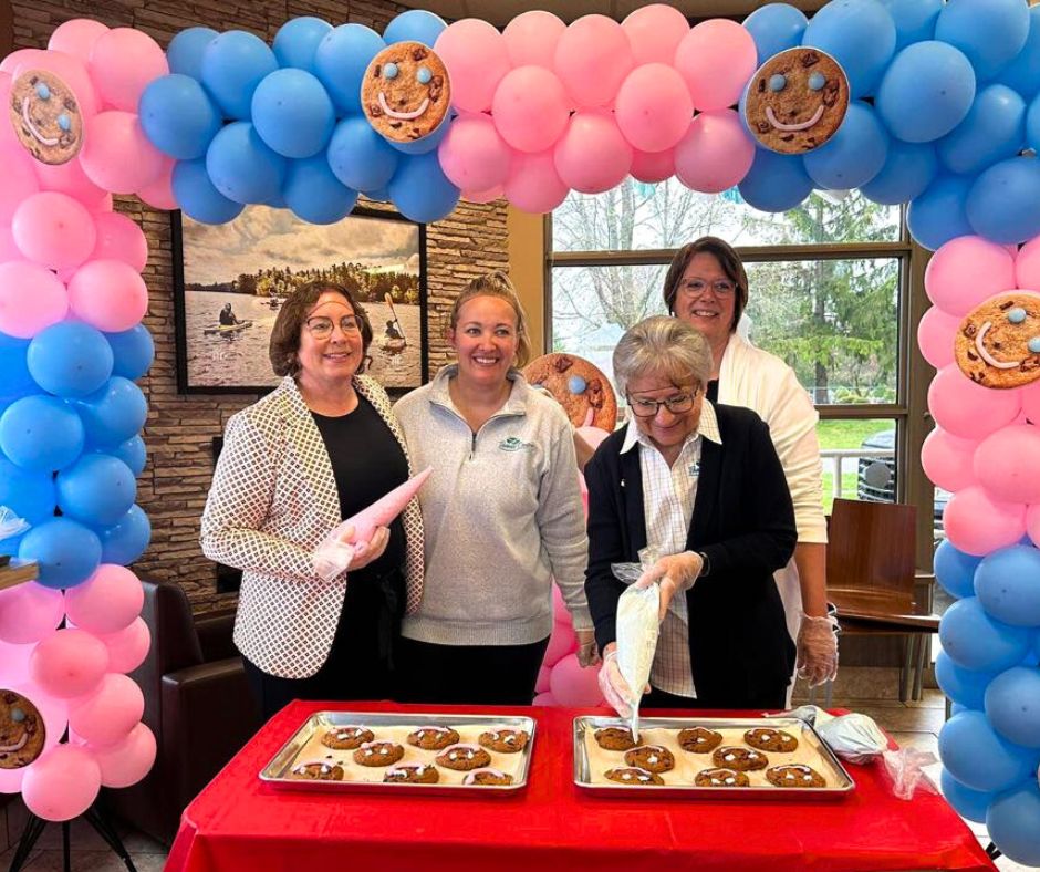 deputy mayor smibert, councillor crockett and mayor mcmillan decorating cookies at the local Tim Hortons
