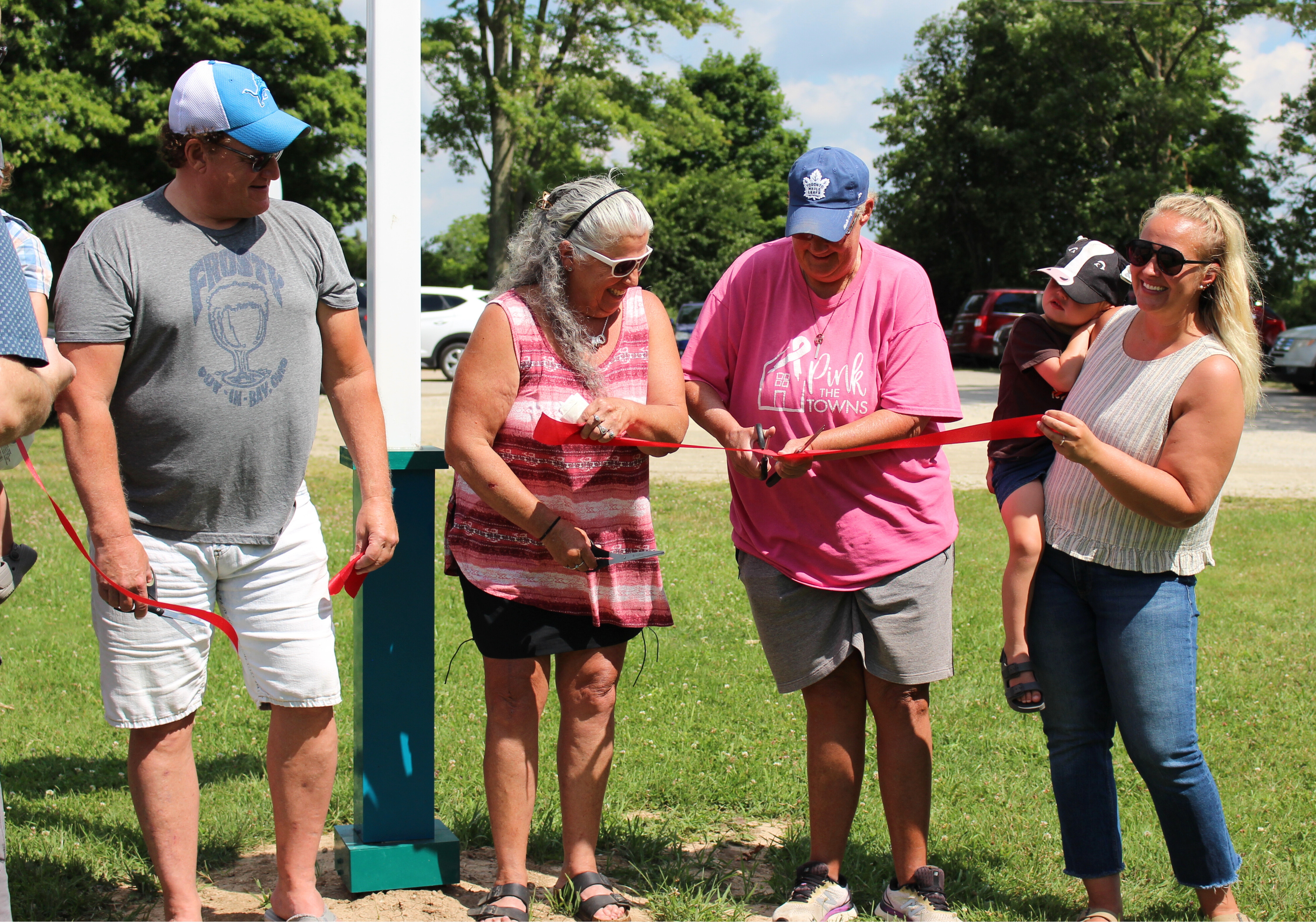 councillor crockett with frost family cutting ribbon at diamond