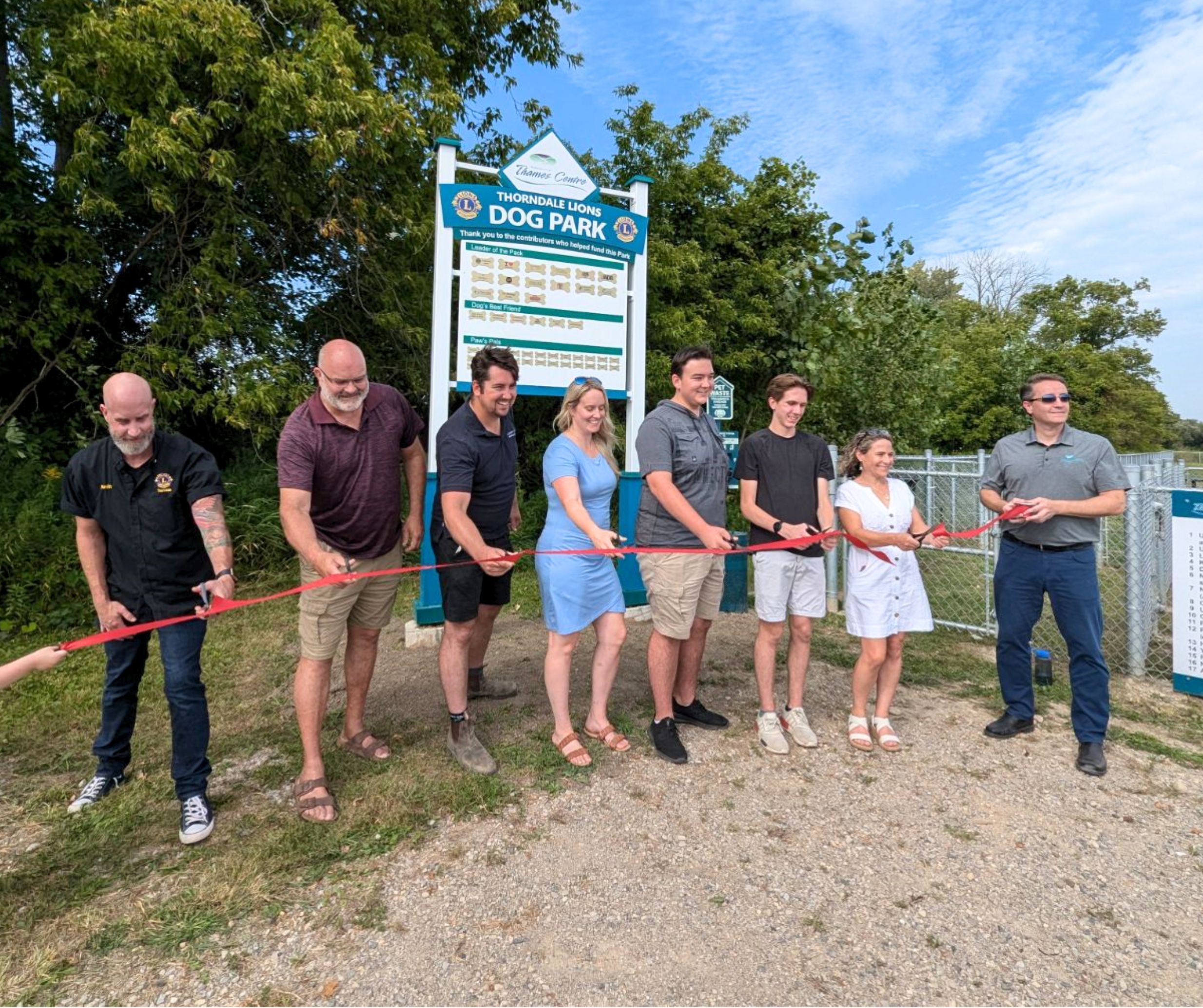 thorndale dog park committee cutting ribbon